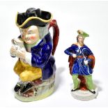 STAFFORDSHIRE; a 19th century figure of a gentleman wearing a feathered cap and a cape, height 21cm,