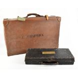 An early 20th century leather suitcase, inscribed 'C. Chadwick' to the top, width 71cm, height 20cm,