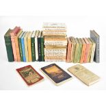 A collection of Beatrix Potter books, with a selection of Wainwright Fell guides, etc.Additional