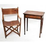 A modern elm and leather folding chair, raised on X-stretcher, together with a side table with