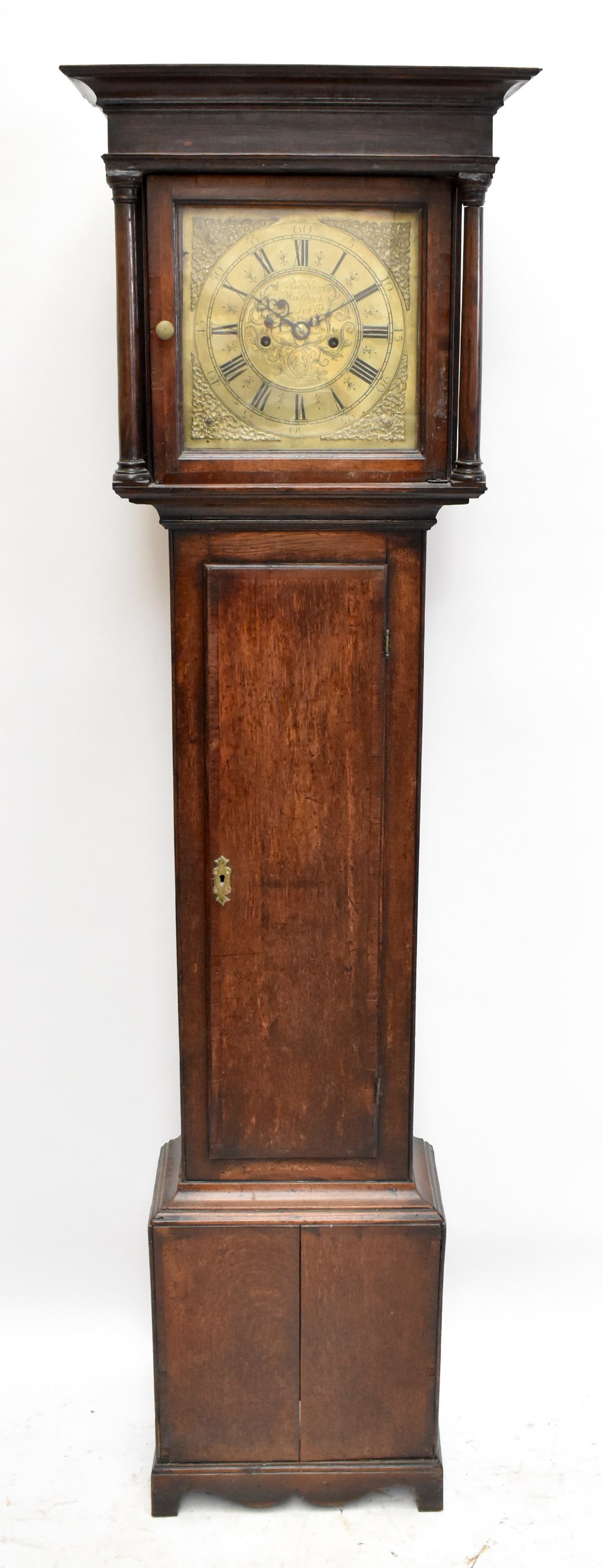 RANDLE MADDOCK; a George III eight day oak longcase clock, with Roman numeral brass chapter ring and