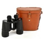 CARL ZEISS; a pair of binoculars, stamped DDR Carl Zeiss Jena, Jenoptem, 10x50w, in a tan leather
