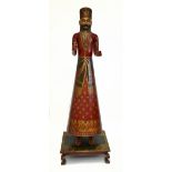 A modern and large Indian carved and painted wooden figure of a male dignitary, profusely