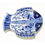 A Japanese Meiji period blue and white fish plate with floral decoration, length 31cm.Additional