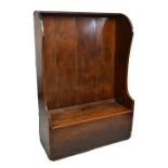 An 18th century and later country made wing back settle with hinged seat, height 160cm, width 112cm,