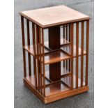 A reproduction inlaid walnut revolving bookcase, width 43cm, height 66cm.Additional InformationThe