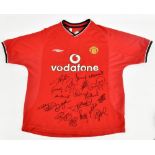 MANCHESTER UNITED; an Umbro 2001 home shirt signed by Woolwork, Veron, Barthez, Yorke, Keane, Van