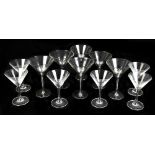 A set of six modern Martini glasses with faceted detailing and silver coloured bases, height 19cm