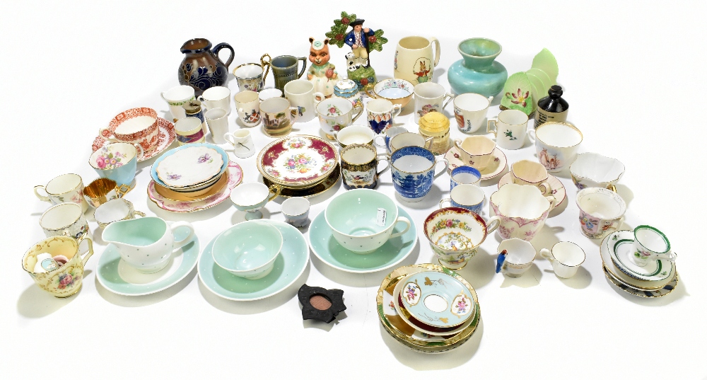 An assortment of decorative cups and saucers, vases, jugs and model animals, including a Carlton