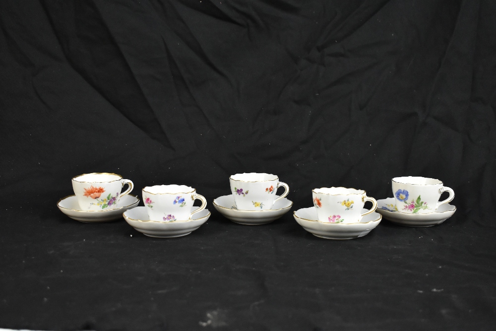 MEISSEN; a harlequin set of five porcelain cups and saucers, each decorated with floral sprigs under - Image 2 of 16