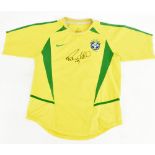 RONALDINHO (Ronaldo de Assis Moreira); a Nike Brazil 2002 child’s home shirt signed to front.