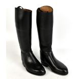 A pair of black leather riding boots, height 46cm, length of sole 26cm. Additional