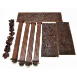 A collection of assorted furniture panels and sections, including three carved oak panels