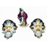 A pair of 19th century Majolica glazed ceramic wall brackets representing Bacchus mask heads, height