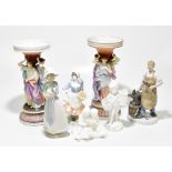 A group of ceramic figures including a near pair of Continental bisque porcelain vases, with figural