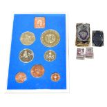 THE ROYAL BRITISH LEGION; two cast metal stamps, with wooden back, together with a Royal Mint