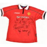 MANCHESTER UNITED TREBLE WINNERS; an Umbro 1998-99 season child’s home shirt signed by Yorke,