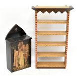 A modern stained pine hanging cupboard, the door decorated with a collage of an Arthurian scene,