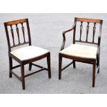A set of four Regency mahogany framed dining chairs with pierced detail to the backs, drop-in
