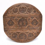 A late 17th/early 18th century carved oak gateleg table top, decorated with roundels of religious