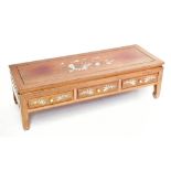 A 1950s Chinese rosewood low coffee table of rectangular form with inlaid mother of pearl detail