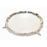 BOODLE & DUNTHORNE; a George VI hallmarked silver card tray with piecrust rim raised on four cast