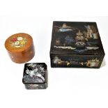 A late 19th century Cantonese lacquered box decorated with scenes of figures and pavilions in