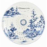 An 18th century Chinese blue and white porcelain drainer of circular form decorated raised to one