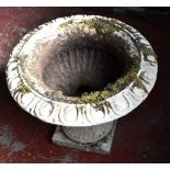 A white painted cast iron garden planter, diameter 60cm.