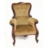 A 19th century carved mahogany armchair raised on front scrolling feet terminating on castors.