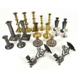 Seven pairs of candlesticks and three single candlesticks including brass examples and a pair of