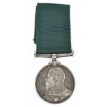 An Edward VII Naval Reserve Long Service and Good Conduct Medal with impressed naming to E. 1938