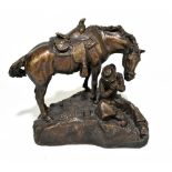 AFTER REMINGTON; a bronzed composition group ‘The Lone Cowboy’, 30cm high