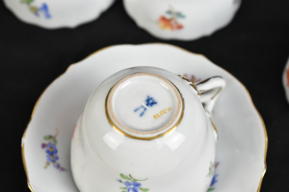 MEISSEN; a harlequin set of five porcelain cups and saucers, each decorated with floral sprigs under - Image 10 of 16