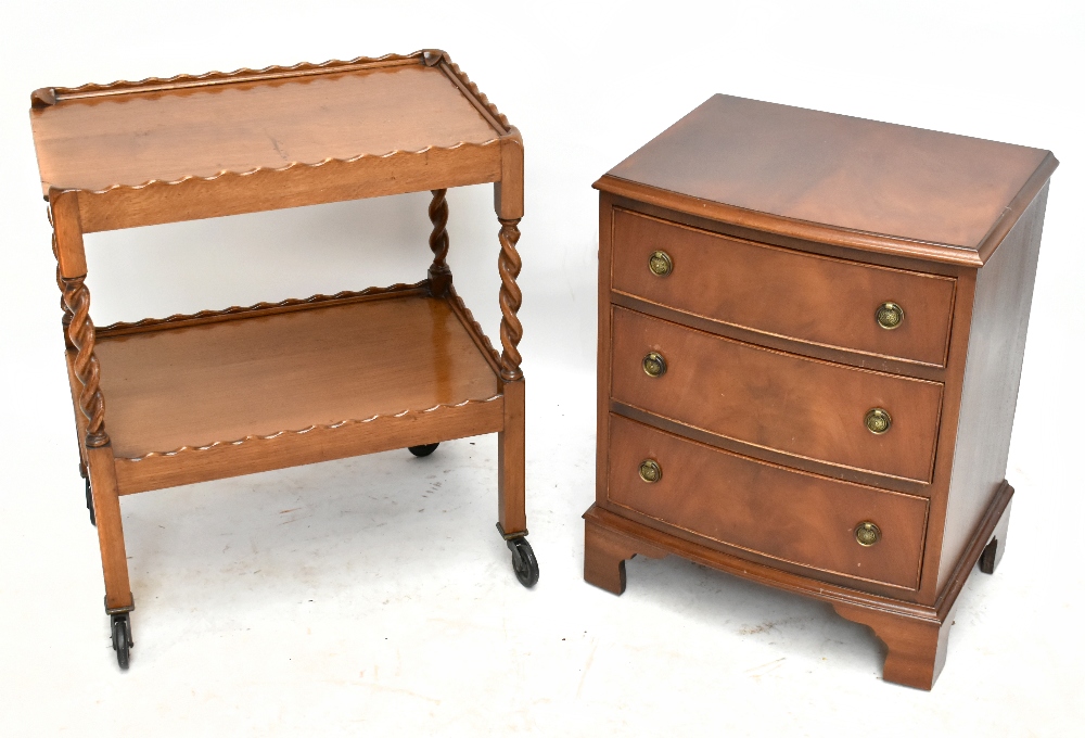 A reproduction walnut bowfront chest, of three long drawers, on bracket feet, height 66cm, width