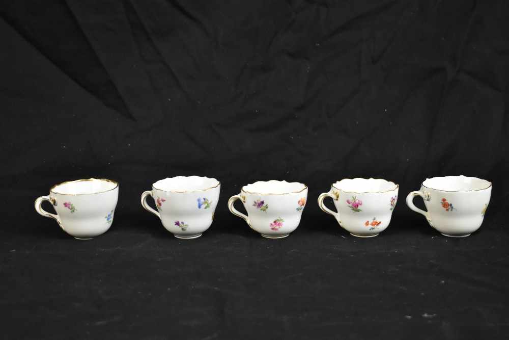 MEISSEN; a harlequin set of five porcelain cups and saucers, each decorated with floral sprigs under - Image 5 of 16