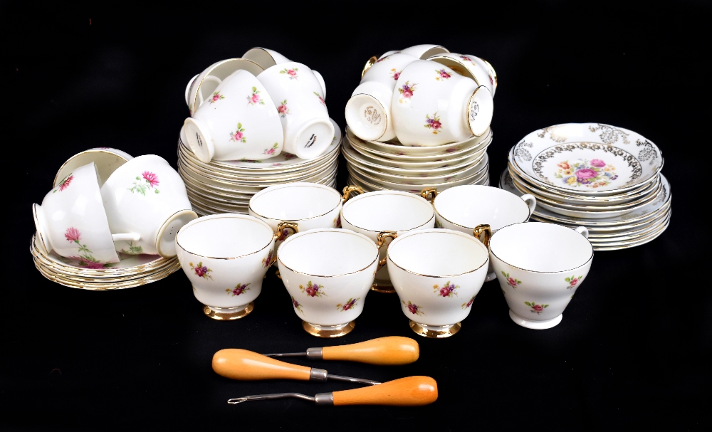 An assortment of decorative tea wares including six plates and saucers printed with flowers under