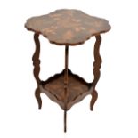A 19th century country two tier occasional table of shaped outline, with fern leaf decoration on