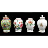 Three Chinese porcelain tea canisters, each with painted floral decoration above applied scrolling