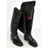 A pair of Maxwell of London black leather full length riding boots, with cut initials GW to the