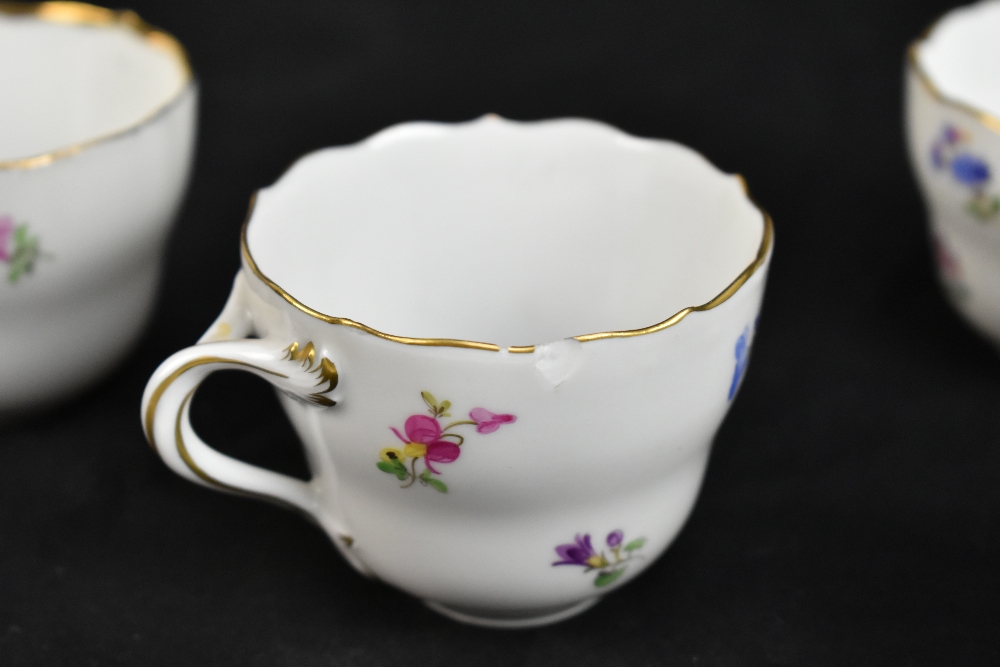 MEISSEN; a harlequin set of five porcelain cups and saucers, each decorated with floral sprigs under - Image 7 of 16