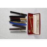 A collection of fountain and ballpoint pens to include two Parker 51, Platignum,