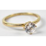 A 9ct yellow gold ring set with cubic zirconium, size L, approx 0.2g.