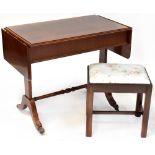 A reproduction drop-leaf side table with leaf to either side,