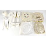 An Edwardian ivory coloured eight-piece dressing table set, two ladies' hair brushes and mirror,