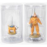 TINTIN; two cylindrical blister packed resin figures 'TinTin Cosmonaut' and 'Haddock Cosmonaut' (2).