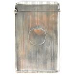 An early 20th century hallmarked silver card case with bands of decoration and a central roundel,
