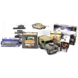 A collection of military themed collectibles to include various scale diecast military vehicles,