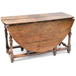 A 19th century oak drop-leaf gateleg table, height 69cm, length when extended approx 150cm.