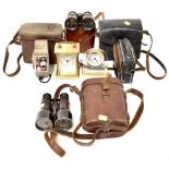 Two pairs of vintage racing binoculars in leather cases comprising a Dolland of London example and